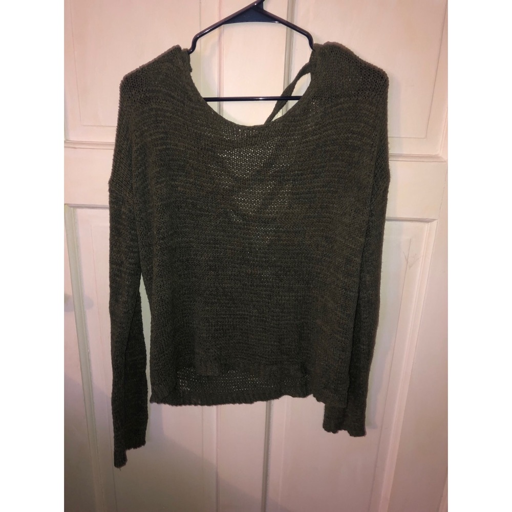 Green knit long sleeved top with cross caged back